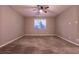 Bedroom features ceiling fan, neutral walls, carpet, and window with blinds at 1544 Karst Pond Ave, North Las Vegas, NV 89084