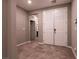 Open foyer with tile flooring, neutral walls, and a double door entry at 1544 Karst Pond Ave, North Las Vegas, NV 89084