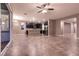 Living area with tile floors open to the kitchen with sliding glass doors at 1544 Karst Pond Ave, North Las Vegas, NV 89084