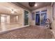 Covered patio featuring stone flooring and an open doorway to the home's interior space at 1544 Karst Pond Ave, North Las Vegas, NV 89084