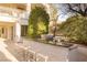 Outdoor kitchen features a built-in grill, countertop, and seating, perfect for entertaining and enjoying the backyard at 2041 Troon Dr, Henderson, NV 89074