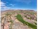 Wide aerial view of the community, highlighting the golf course, desert landscape, and residential areas at 21 Via Visione # 201, Henderson, NV 89011