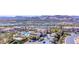 Aerial view of the Primary planned community with luxurious homes surrounding community pool, lake and mountains at 21 Via Visione # 201, Henderson, NV 89011