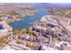 Aerial view showcasing waterfront homes, a marina, and desert landscape at 21 Via Visione # 201, Henderson, NV 89011