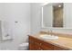 Bright bathroom featuring vanity with granite countertop, tile backsplash and stand up shower at 21 Via Visione # 201, Henderson, NV 89011