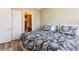 Comfortable bedroom with two beds, wood floors, and closet access at 21 Via Visione # 201, Henderson, NV 89011