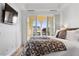 Bright bedroom with a balcony that offers great mountain views through arched openings at 21 Via Visione # 201, Henderson, NV 89011