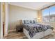 Bedroom with two beds, wood floors, and natural light from a window at 21 Via Visione # 201, Henderson, NV 89011