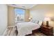 Cozy bedroom with wood floors, natural light, and side tables at 21 Via Visione # 201, Henderson, NV 89011