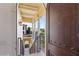 Welcoming entryway with wrought iron gate and arched doorway at 21 Via Visione # 201, Henderson, NV 89011