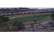 A view of the golf course from an elevated position at dusk at 21 Via Visione # 201, Henderson, NV 89011
