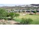Beautiful view of the golf course, community homes, and desert mountains in the distance at 21 Via Visione # 201, Henderson, NV 89011