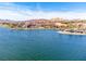 Scenic lake view highlighting the waterfront properties, resort, and desert mountains in the distance at 21 Via Visione # 201, Henderson, NV 89011