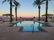 Community pool featuring beautiful mountain views, palm trees, cabanas and plenty of space to enjoy the outdoors at 21 Via Visione # 201, Henderson, NV 89011