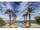 Luxury community pool featuring meticulously designed water features with stunning lake and mountain views at 21 Via Visione # 201, Henderson, NV 89011