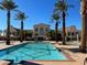 Stylish community pools surrounded by lush landscaping, cabanas, and inviting lounge areas offer a tranquil escape at 21 Via Visione # 201, Henderson, NV 89011