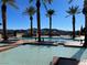 Beautiful community pools with palm trees, cabanas and mountain views provide a relaxing retreat at 21 Via Visione # 201, Henderson, NV 89011