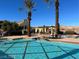 Resort-style pool features surrounding landscaping, seating, and blue water on a sunny day at 21 Via Visione # 201, Henderson, NV 89011