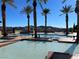 Resort-style pool features surrounding landscaping, seating, and mountain views at 21 Via Visione # 201, Henderson, NV 89011