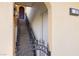 Exterior staircase with metal railing leads to upper-level unit entrance at 21 Via Visione # 201, Henderson, NV 89011