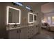 Bright bathroom showcasing an expansive double vanity and ensuite bedroom access at 2125 Desert Woods Dr, Henderson, NV 89012