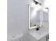 Bright bathroom features a white sink and lighted mirror at 2125 Desert Woods Dr, Henderson, NV 89012