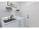 Bright laundry room features modern washer and dryer at 2125 Desert Woods Dr, Henderson, NV 89012