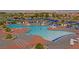 Community pool featuring ample seating and shaded umbrellas at 2253 Laurel Heights Ln, Henderson, NV 89052