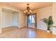 Bright dining area featuring tile flooring and chandelier, with a view to the outside at 2253 Laurel Heights Ln, Henderson, NV 89052