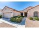 Inviting single-story home showcasing a two-car garage and manicured landscaping at 2253 Laurel Heights Ln, Henderson, NV 89052