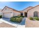 Inviting home exterior with a tidy front yard and a paved walkway to the front door at 2253 Laurel Heights Ln, Henderson, NV 89052