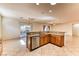 Open kitchen with a breakfast bar and stainless steel dishwasher overlooking the backyard at 2253 Laurel Heights Ln, Henderson, NV 89052