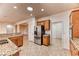 The kitchen features wood cabinets, granite countertops, and stainless steel appliances at 2253 Laurel Heights Ln, Henderson, NV 89052