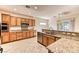 Spacious kitchen with wood cabinets, granite countertops, and stainless steel appliances at 2253 Laurel Heights Ln, Henderson, NV 89052