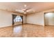 Spacious living room is illuminated with natural light from the window, featuring tile flooring and ceiling fan at 2253 Laurel Heights Ln, Henderson, NV 89052