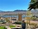 Scenic backyard view with a lake, mountains and desert views at 24 Cliffwater St, Henderson, NV 89011