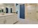 Bright bathroom with white cabinets, quartz countertops, and a glass-enclosed shower with seating at 24 Cliffwater St, Henderson, NV 89011