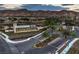 Del Webb Lake Las Vegas community entrance featuring lush desert landscaping and welcoming signage against a mountain backdrop at 24 Cliffwater St, Henderson, NV 89011