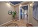 Welcoming entryway with hardwood floors, modern lighting, and tasteful decor at 24 Cliffwater St, Henderson, NV 89011