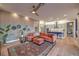 Inviting living room with hardwood floors, modern decor, and an open floor plan into the kitchen at 24 Cliffwater St, Henderson, NV 89011