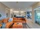 Inviting living room featuring hardwood floors and decor with kitchen in background at 24 Cliffwater St, Henderson, NV 89011