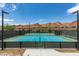 Well-maintained tennis courts set against a backdrop of scenic mountains, perfect for sports and recreation at 24 Cliffwater St, Henderson, NV 89011