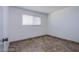 Cozy bedroom with neutral walls, tiled floor, and natural light from a window at 26 Jade Circle Cir, Las Vegas, NV 89106