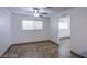 Cozy bedroom with natural light, ceiling fan, and neutral flooring at 26 Jade Circle Cir, Las Vegas, NV 89106