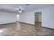 Open living room with tile floors, neutral walls, and modern ceiling fan at 26 Jade Circle Cir, Las Vegas, NV 89106