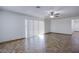 Bright living room with tiled floor and large sliding glass doors for ample natural light at 26 Jade Circle Cir, Las Vegas, NV 89106