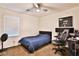 This bedroom features a ceiling fan, carpeted floors, and a single window for soft natural light at 2832 Aragon Terrace Way, Henderson, NV 89044