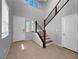 Bright foyer featuring tile flooring, staircase, and an open layout at 2832 Aragon Terrace Way, Henderson, NV 89044