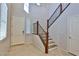 Bright foyer featuring tile flooring, staircase, and an open layout at 2832 Aragon Terrace Way, Henderson, NV 89044