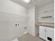 This laundry room features tile floors, ample shelving, countertop and lower cabinet storage at 2832 Aragon Terrace Way, Henderson, NV 89044